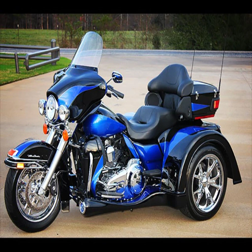 Custom blue trike with high-performance wheels and sleek design
